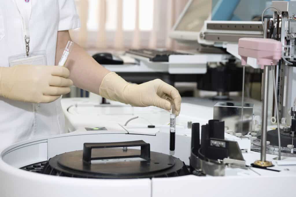 lab technician with a centrifuge
